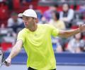 Karlovic stuns Cilic, Isner aces it in Shanghai