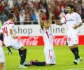 La Liga: Sevilla climb to summit, Atletico win