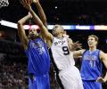 NBA: Spurs edge Mavs in San Antonio to open title defense