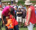 PHOTOS: Tiger Woods with his two adorable caddies