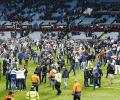 Villa charged following fans' pitch invasion