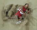 PHOTOS: Taylor wins triple jump gold with second-longest ever leap