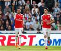 Premier League: Arsenal labour to victory over 10-man Newcastle