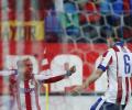 Atletico use their heads to turn up heat on Real