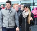 PIX: Golfer McIlroy walks hand-in-hand with girlfriend