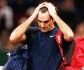 Paris Masters PHOTOS: Federer knocked out by big-serving Isner, Nadal survives