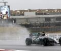 US Grand Prix: Hamilton fastest as fans shut out by rain