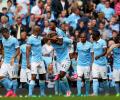 Man City flex muscles as English clubs break spending record