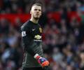 Soccer shots: De Gea signs new four-year United contract