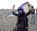 PHOTOS: Women paragliders soar through Kabul's skies