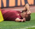 Euro football: Roma win bloody derby; Hamburg record 1st win