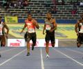 Blake completes Jamaican sprint double in Bolt's absence