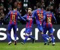 PHOTOS: Messi double lifts Barcelona, Man City advance