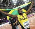 World C'ships PIX: McLeod wins hurdles; Rojas puts Venezuela on map