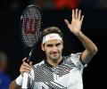 PHOTOS: Federer makes winning return at Australian Open