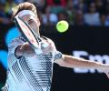 Federer wary of Berdych test after fending off Rubin challenge