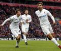 Liverpool title challenge dented by Swansea