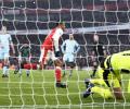 EPL: Ten-man Arsenal win thriller with last-gasp penalty; Chelsea stretch lead