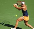 Kerber rallies to reach fourth round; Halep bows out