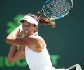 Italian Open: Muguruza survives day of shocks, Kerber out