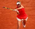 French Open PHOTOS: Wozniacki survives scare, Muguruza advances