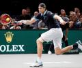 Isner keeps Tour finals hopes alive as Nadal withdraws in Paris