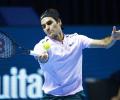 Razor-sharp Federer races through in Basel