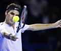 Federer digs deep to beat Mannarino and reach semis