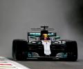 Hamilton beats rain to break Schumacher's pole record