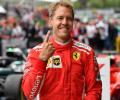 Ferrari's Vettel wins in Belgium to rein in Hamilton