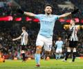 PHOTOS: Aguero treble gets City back on track; United keep up chase