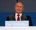 Defiant Putin welcomes World Cup as Russia win