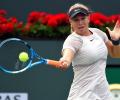 American teen Anisimova stuns Wang, Tomic crashes out