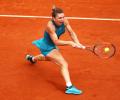 French Open PIX: Halep rallies to advance; Djokovic, Kvitova through