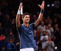 Djokovic marks return to world number one with easy win