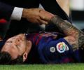 PHOTOS: Messi injury blow as Barca go top with win over Sevilla