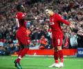 Champions League PIX: Liverpool down Porto; Spurs edge City