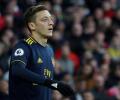 Soccer Extras: China state TV cancels Arsenal-City game after Ozil hits out