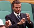 Beckham gets six-month driving ban for using phone