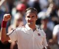 Federer earns another milestone; Nadal powers past Goffin