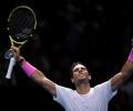 Nadal battles from brink to beat Medvedev