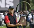 Woods wins in Japan, ties Snead for PGA Tour record