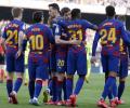 Barcelona sneak past Getafe to keep pressure on Real