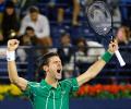 Djokovic stages great escape to enter Dubai final