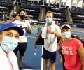 With elbow bumps, masked fans, World TeamTennis kicks off