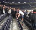 Tottenham's Dier jumps into stands to fight a fan