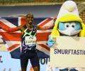 Farah returns to track in style by breaking world record