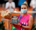 Halep claims Rome title after Pliskova retires with injury