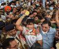 PIX: Frenzy, chaos as India's Olympics heroes return