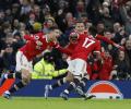 PICS: Manchester Utd edge Palace; Spurs have it easy